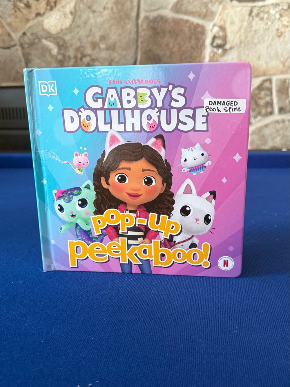 DreamWorks Gabby’s Dollhouse Pop-Up Peekaboo! Kids Board Book - Pink & Teal